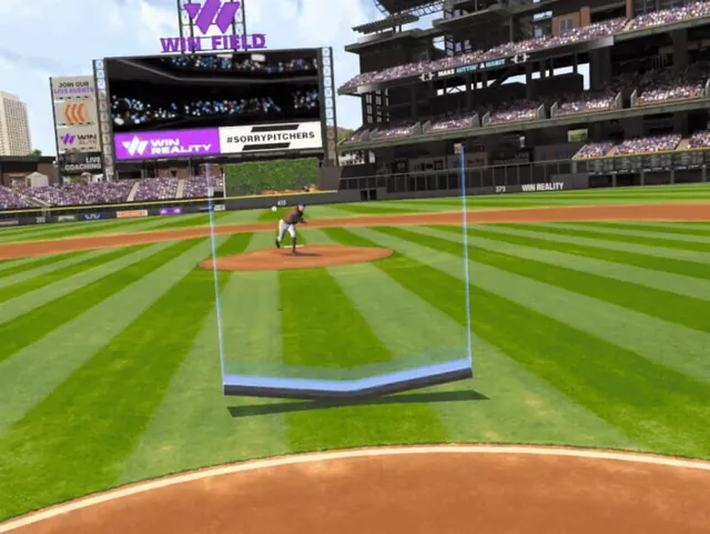 The pitcher mid-delivery, seen from behind home plate through a translucent blue frame that marks the strike zone.
